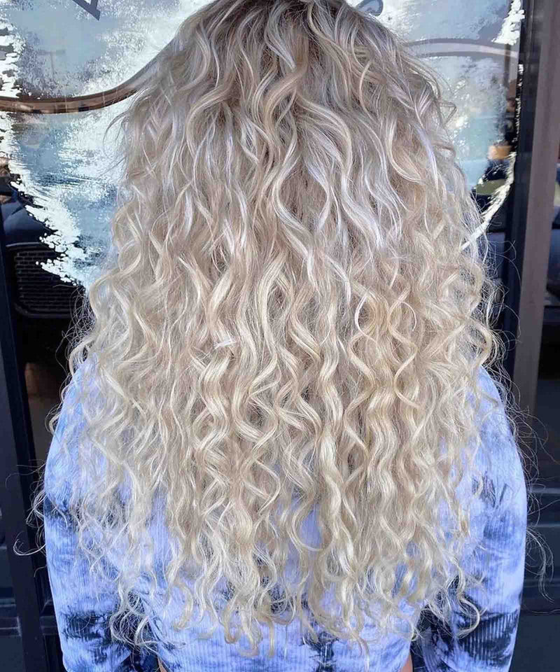 ice blonde (60S) curly tape in hair extensions by Perfect Locks#color_ice-blonde-(60S)